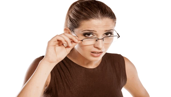 lady pulling down her glasses while looking quizzically at you