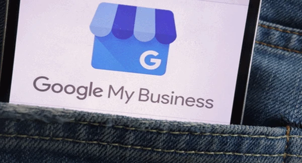 image of someone's blue denium back pocket with a piece of paper with "Google My Business" printed on it